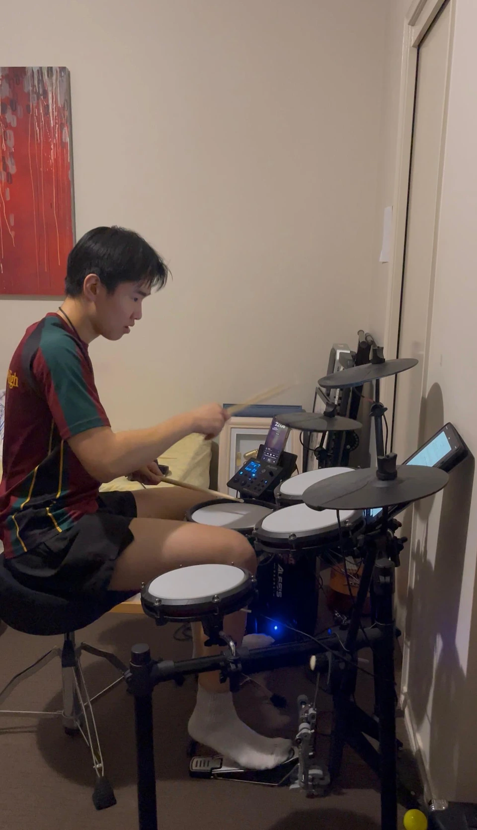 Isaac playing drums